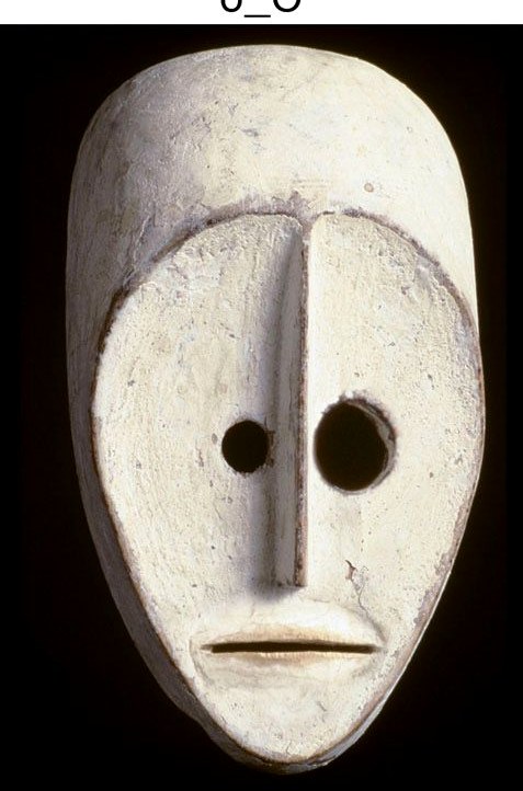 A carved white mask against black, cropped tight against its own catalog caption.
